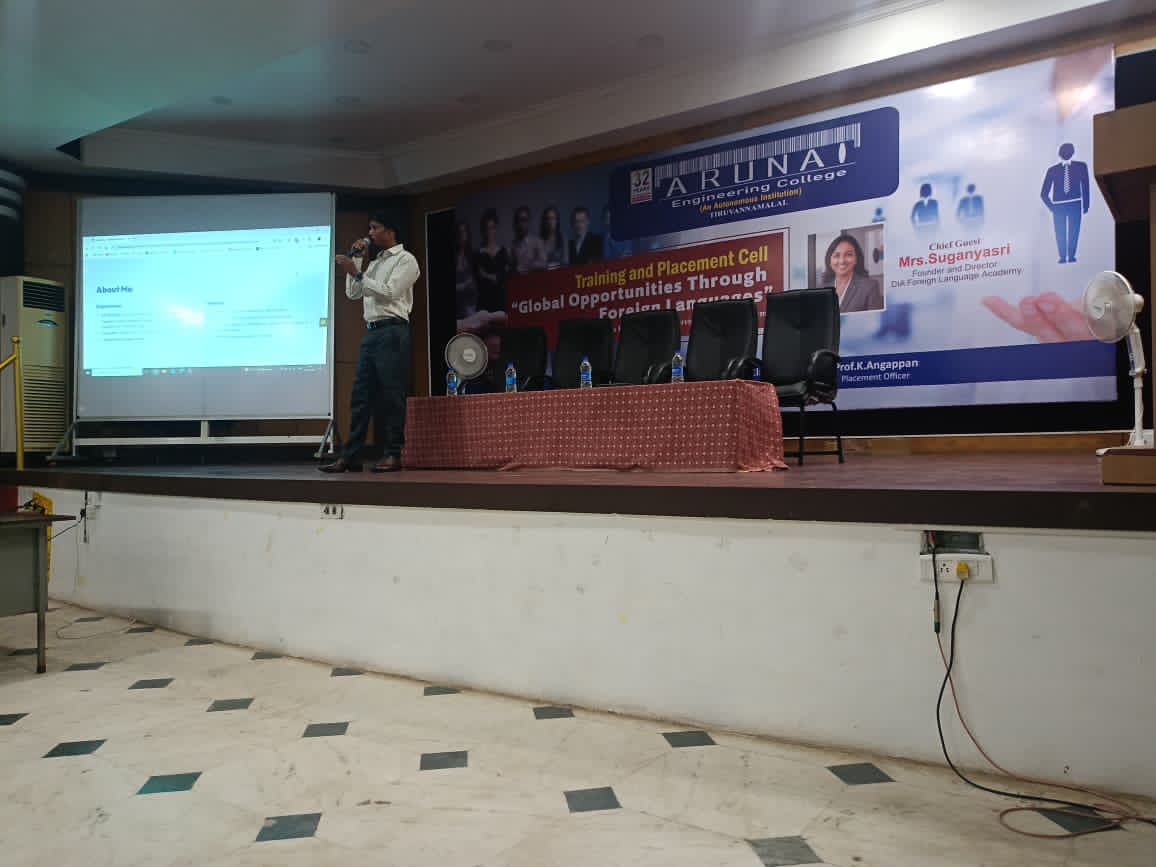 Ajith speaking to a large group of students